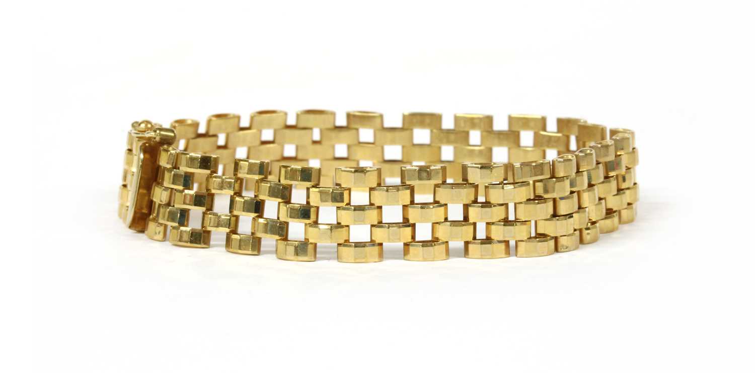 Lot 56 - A 9ct gold three row faceted panther link bracelet