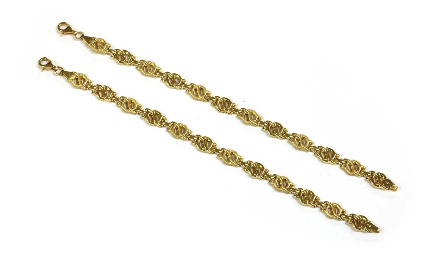 Lot 202 - A pair of 18ct gold fancy hollow link bracelets