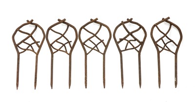 Lot 386 - A collection of wrought iron lawn edging