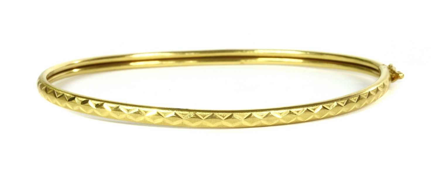 Lot 45 - A 22ct gold oval bangle
