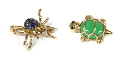 Lot 320 - A 9ct gold ruby and sapphire set spider brooch/pendant