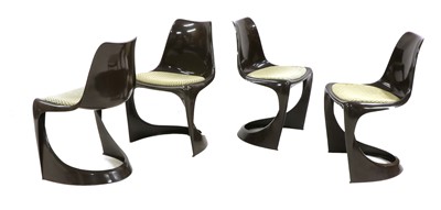 Lot 252 - A set of four moulded brown chairs