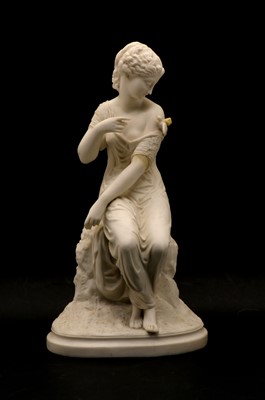 Lot 106 - A parian group depicting a seated girl