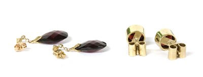 Lot 302 - A pair of gold single stone garnet stud earrings