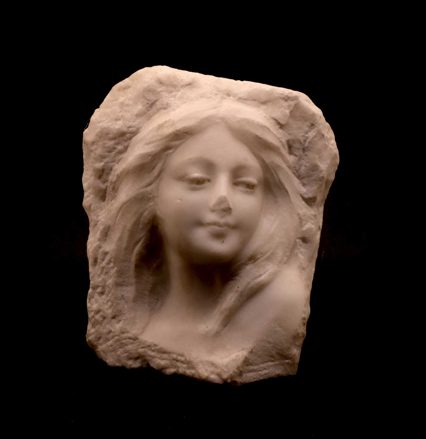 Lot 86 - A carved marble bust in relief of a young woman