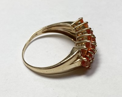 Lot 325 - A 9ct gold three row fire opal ring