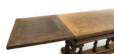 Lot 300 - A 19th century oak draw leaf table