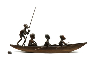 Lot 99 - A North African carved hardwood model of a tribal rowing boat