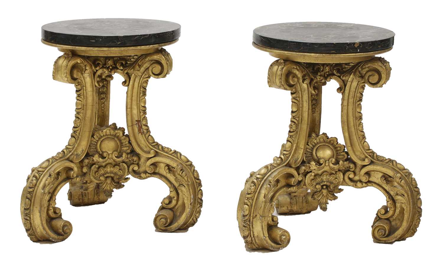 Lot 282 - A pair of ornately carved giltwood stands