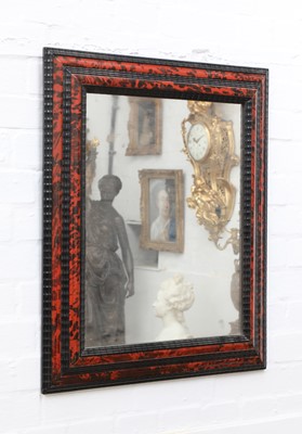 Lot 118 - Two similar red tortoiseshell and ebonised wall mirrors