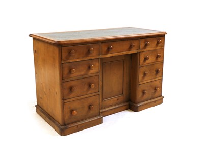 Lot 241 - A Victorian stripped pine kneehole desk