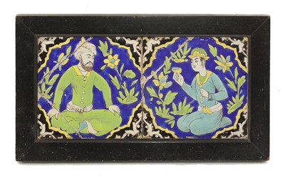 Lot 960 - A Qajar cuerda seca pottery tile panel