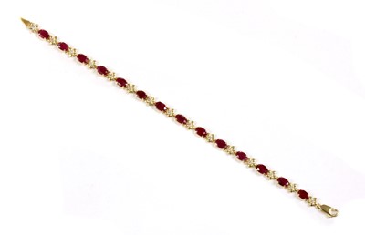 Lot 131 - A 14ct gold ruby and diamond bracelet