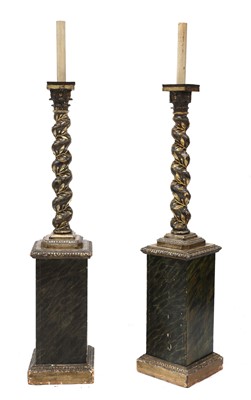 Lot 168 - A pair of carved wooden lamp standards