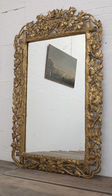 Lot 178 - A large 'faux bois' carved, giltwood gesso wall mirror