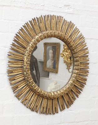 Lot 199 - A Spanish giltwood sunburst wall mirror