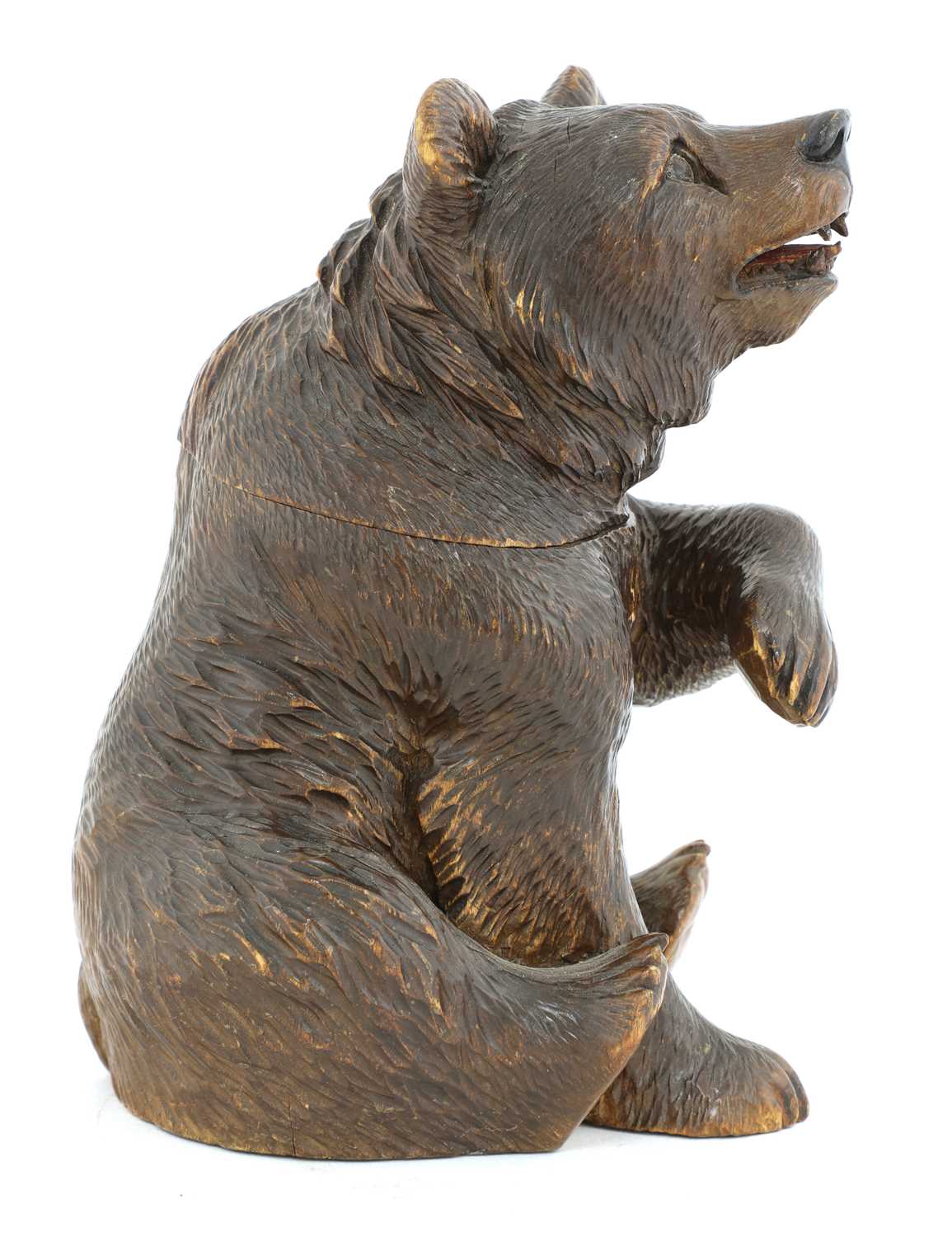Lot 64 - A Black Forest carved wooden bear tobacco jar,