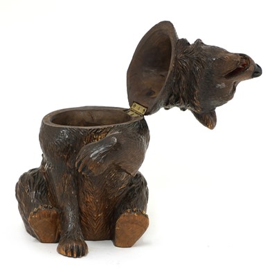 Lot 64 - A Black Forest carved wooden bear tobacco jar