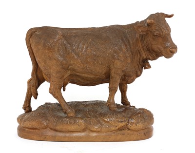 Lot 703 - A Black Forest carved wooden model of a cow