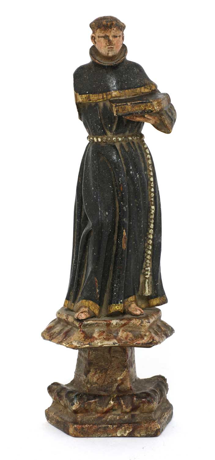Lot 141 - A carved wooden and painted figure of a monk
