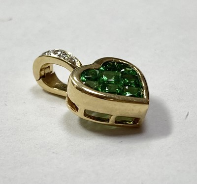Lot 309 - An 18ct gold tsavorite garnet and diamond heart shaped pendant
