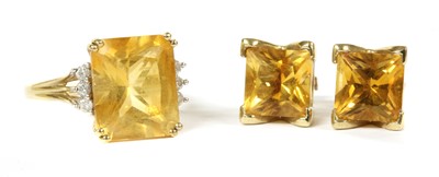 Lot 287 - A 9ct gold citrine and diamond ring