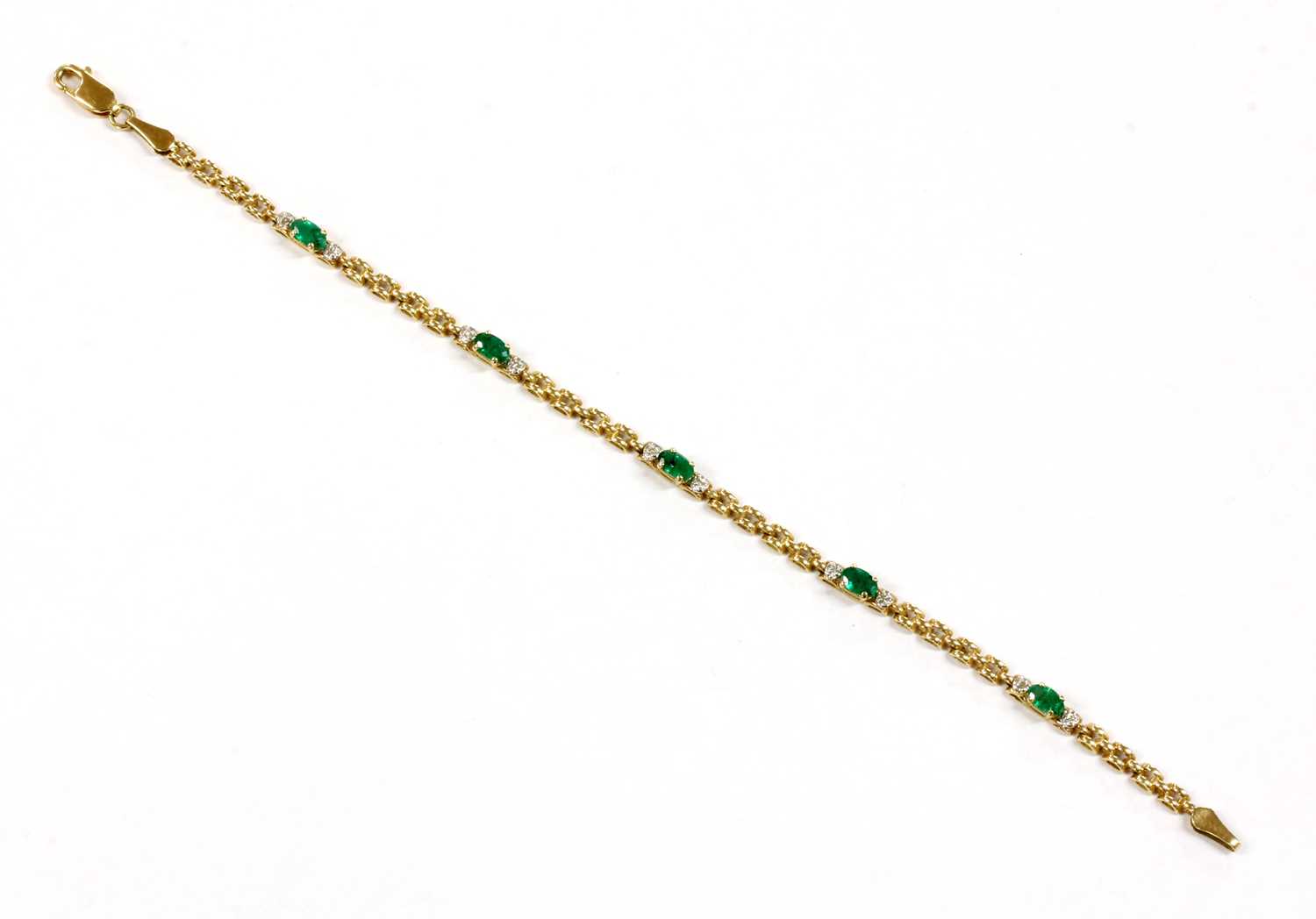 Lot 105 - A 9ct gold emerald and diamond bracelet