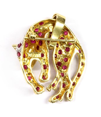 Lot 119 - A gold ruby and diamond panther brooch/pendant
