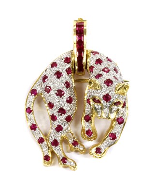 Lot 119 - A gold ruby and diamond panther brooch/pendant