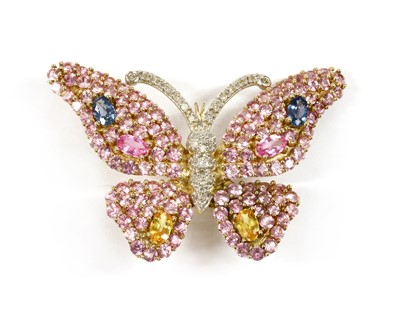 Lot 235 - A 9ct gold diamond and varicoloured sapphire butterfly brooch/pendant