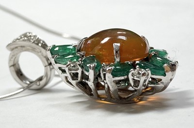 Lot 326 - A white gold fire opal, emerald and diamond pendant
