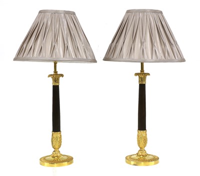 Lot 766 - A pair of French Empire-style gilt-bronze and bronze table lamps
