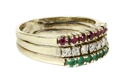 Lot 117 - A white gold ruby, diamond and emerald ring