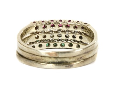 Lot 117 - A white gold ruby, diamond and emerald ring