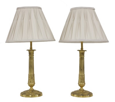 Lot 341 - A pair of French Empire-style ormolu table lamps