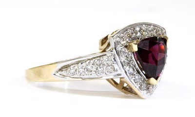 Lot 297 - A 14ct gold garnet and diamond cluster ring