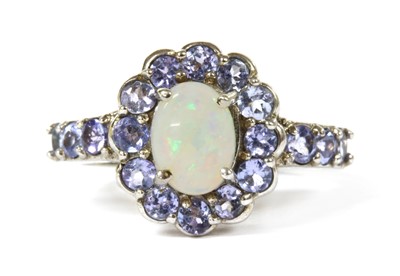 Lot 328 - A 9ct white gold opal and tanzanite cluster ring
