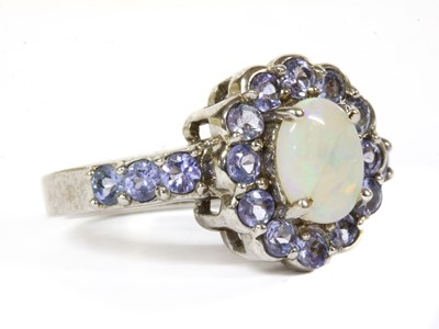 Lot 328 - A 9ct white gold opal and tanzanite cluster ring