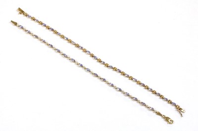 Lot 248 - A 9ct gold tanzanite and diamond bracelet