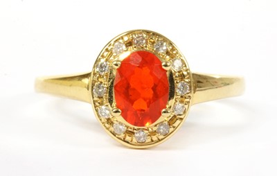 Lot 323 - An 18ct gold fire opal and diamond cluster ring