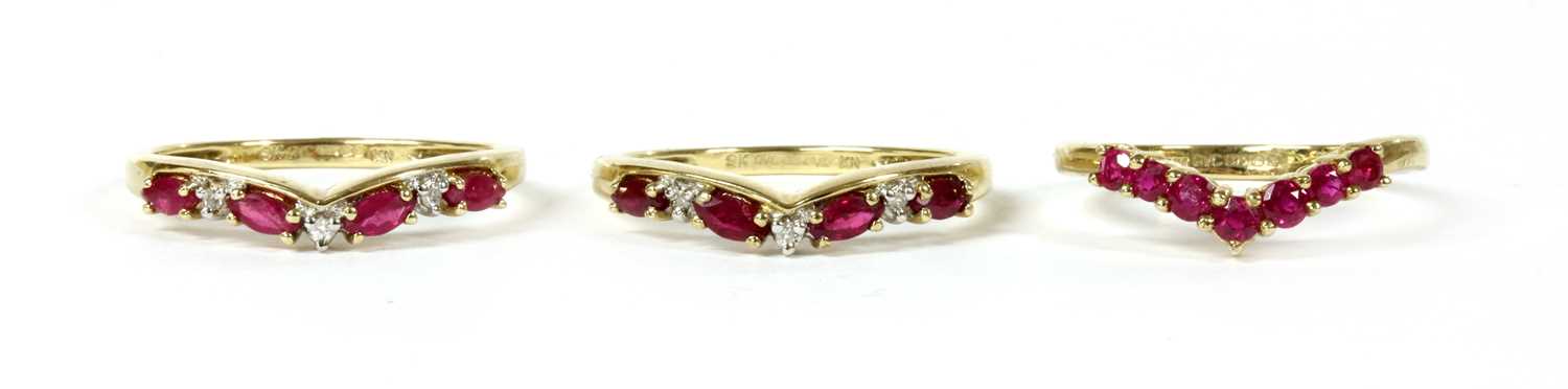 Lot 133 - A pair of 9ct gold ruby and diamond shaped rings
