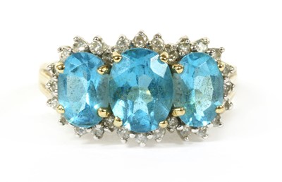 Lot 258 - A 9ct gold blue topaz and diamond triple cluster ring