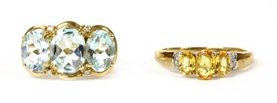 Lot 373 - A 9ct gold yellow sapphire and diamond ring