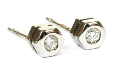 Lot 69 - A pair of 18ct white gold single stone diamond stud earrings