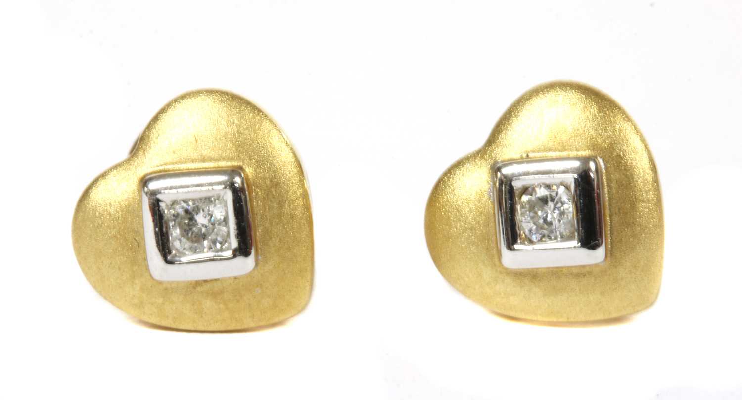 Lot 155 - A pair of 18ct gold single stone heart shaped stud earrings
