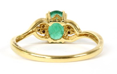 Lot 102 - A 9ct gold emerald and diamond ring