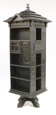 Lot 853 - An American 'Tabard Inn Library' ebonised oak revolving bookcase
