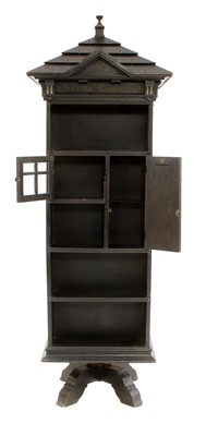 Lot 853 - An American 'Tabard Inn Library' ebonised oak revolving bookcase