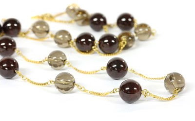 Lot 182 - A gold garnet and smoky quartz necklace