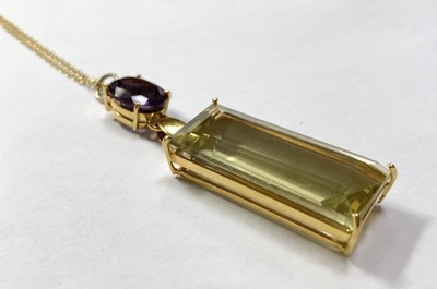 Lot 278 - A gold citrine and amethyst pendant